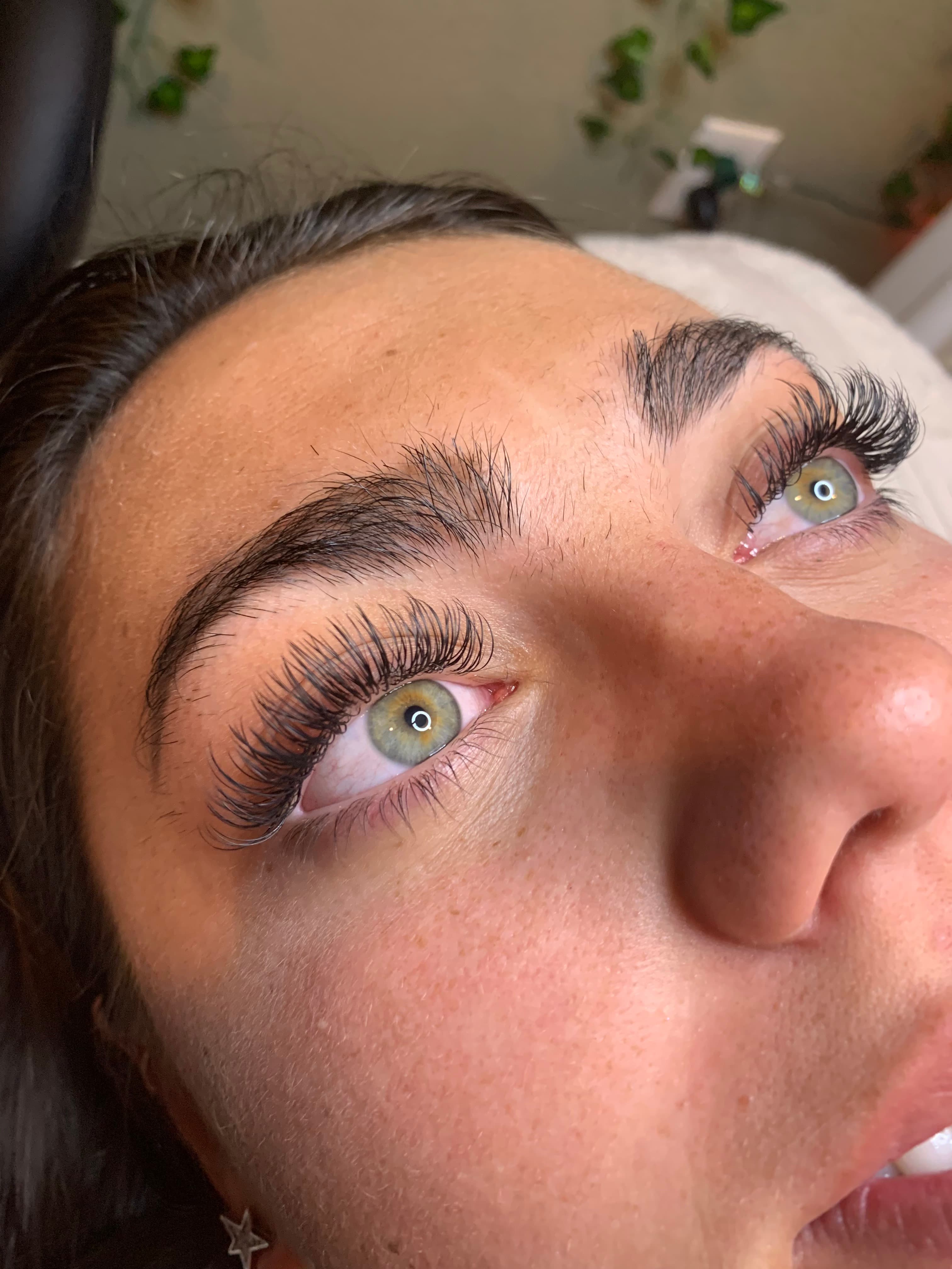 Real client showing Volume lash extension result applied at Lovely Lilly's North Austin studio