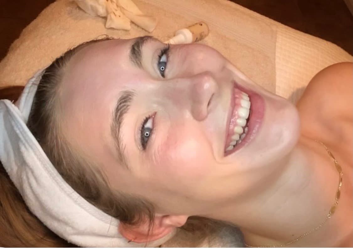 Real client with joyful expression post-treatment at Lovely Lilly's North Austin studio